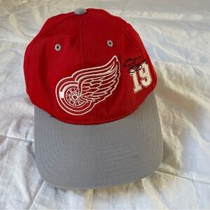 NHL Licensed Cap with Red Wings Logo and signed by The Captain, Stevie Yzerman